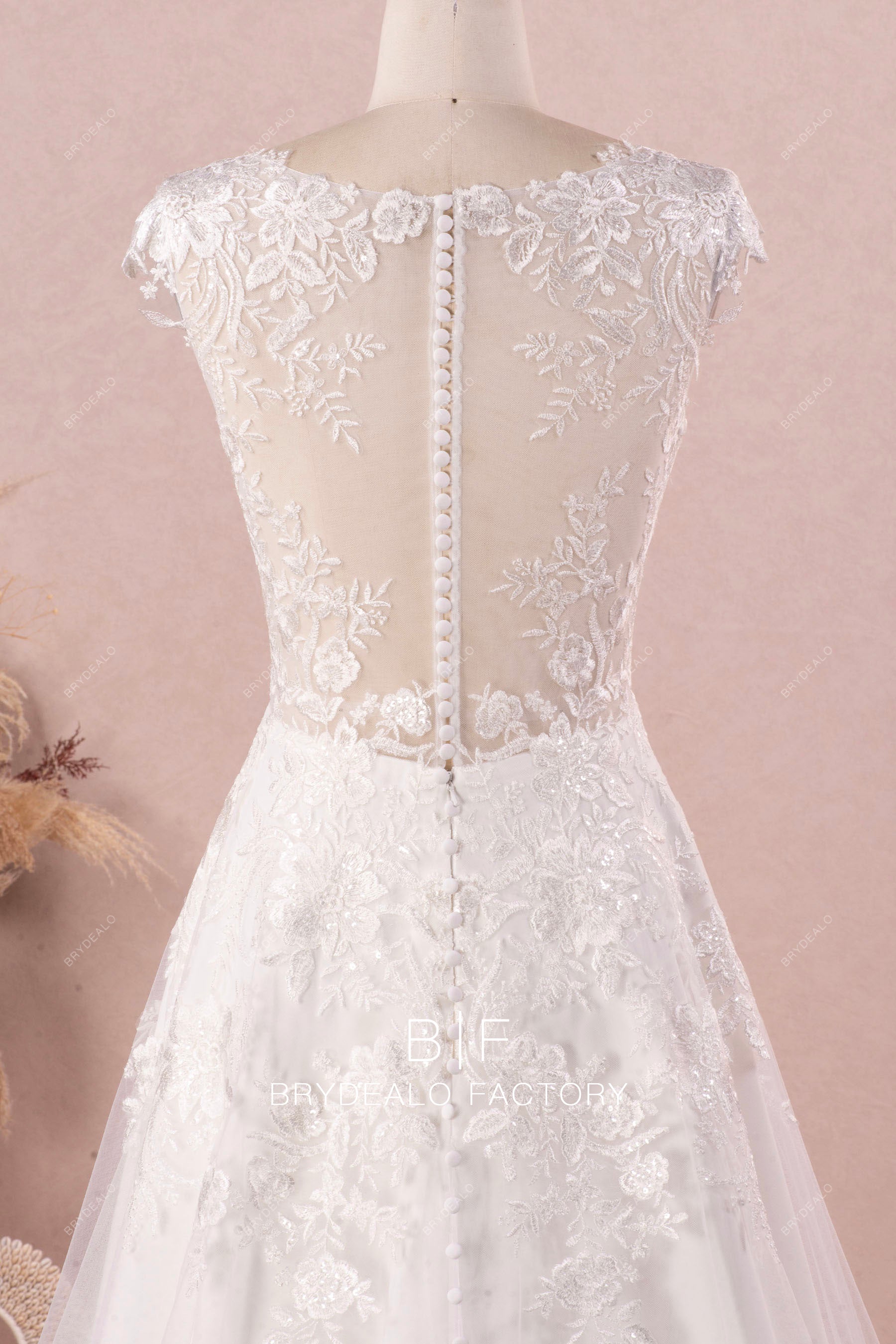 illusion cap sleeve buttoned lace back wedding dress