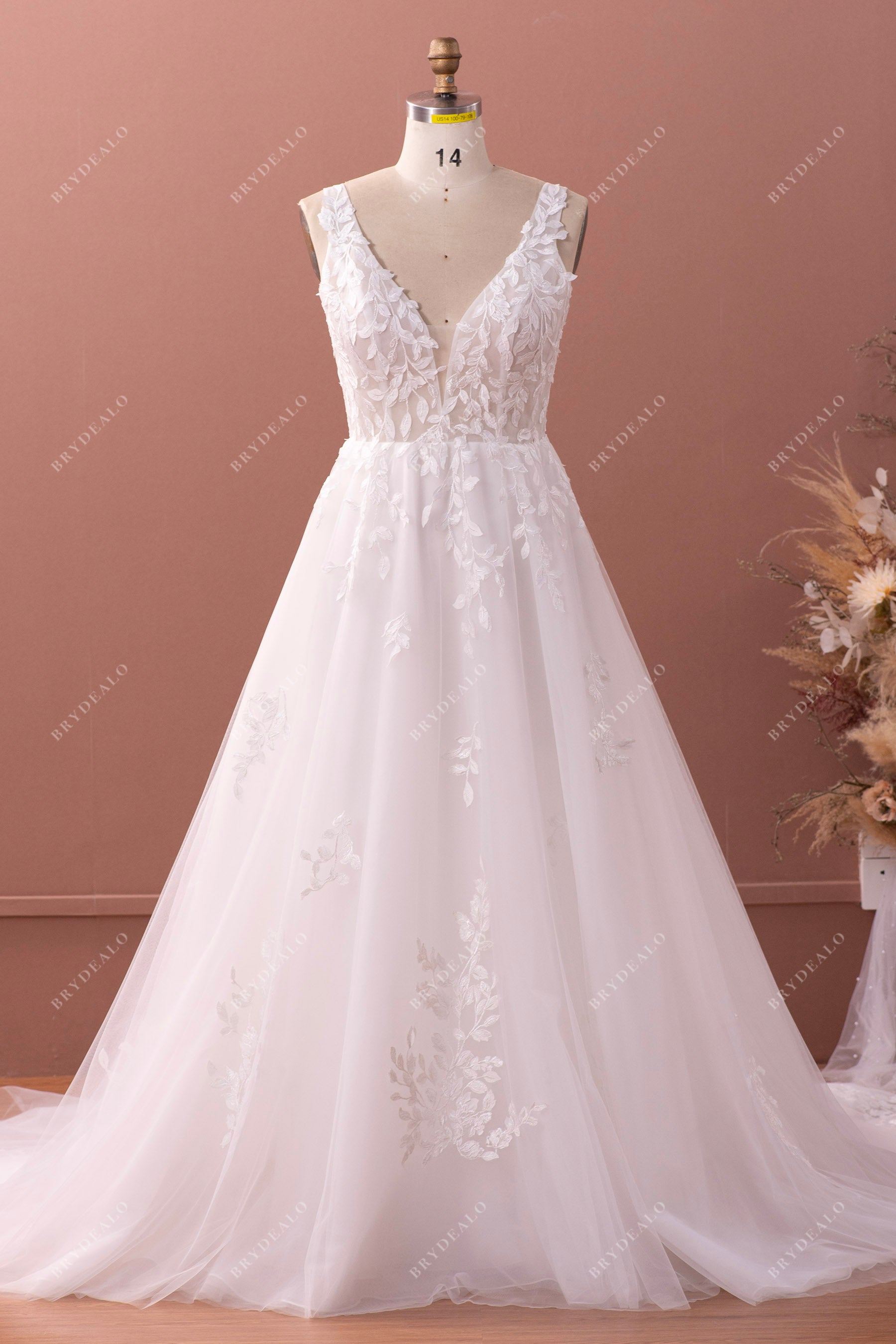 illusion plunging bodice A-line lace wedding gown