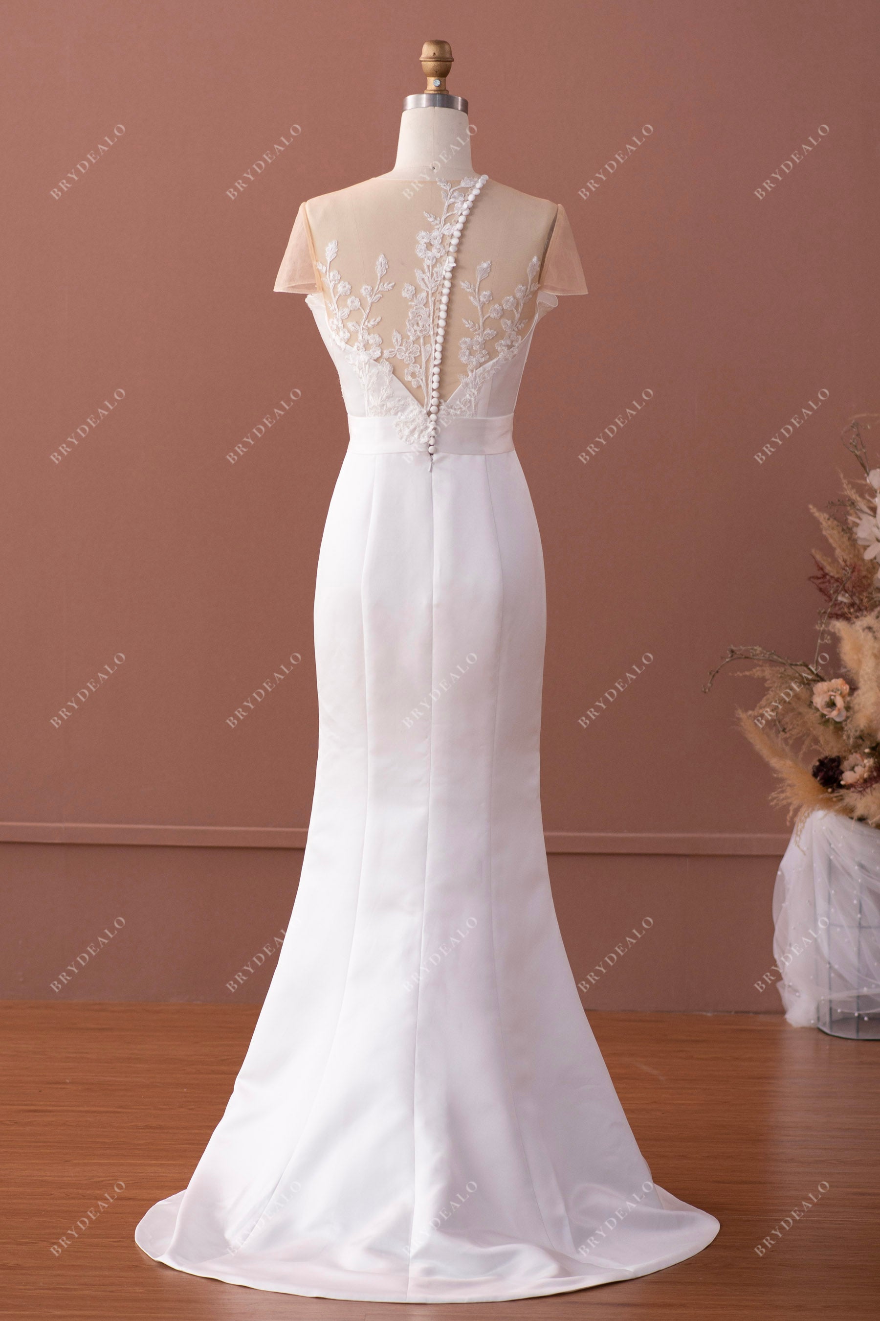 inclined buttoned back mermaid satin wedding gown