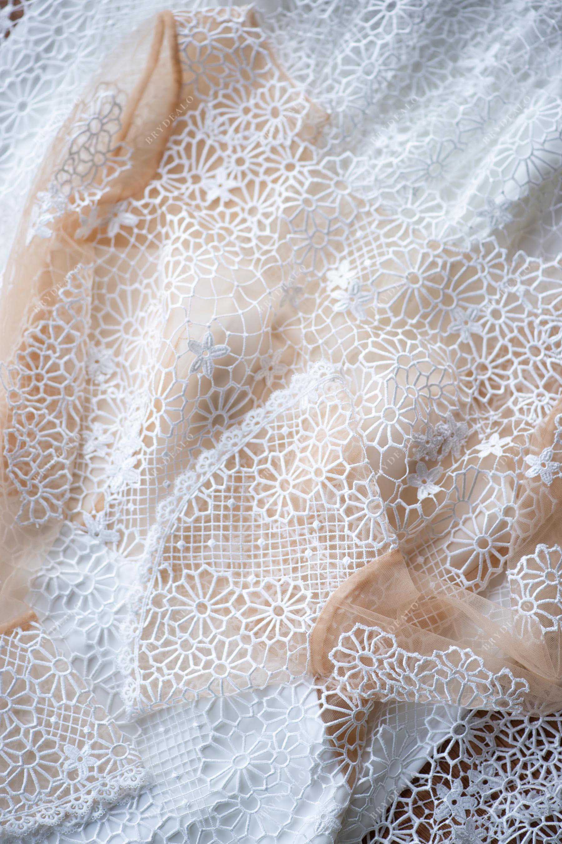 ivory snow lace overlaid nude tulle wedding gown