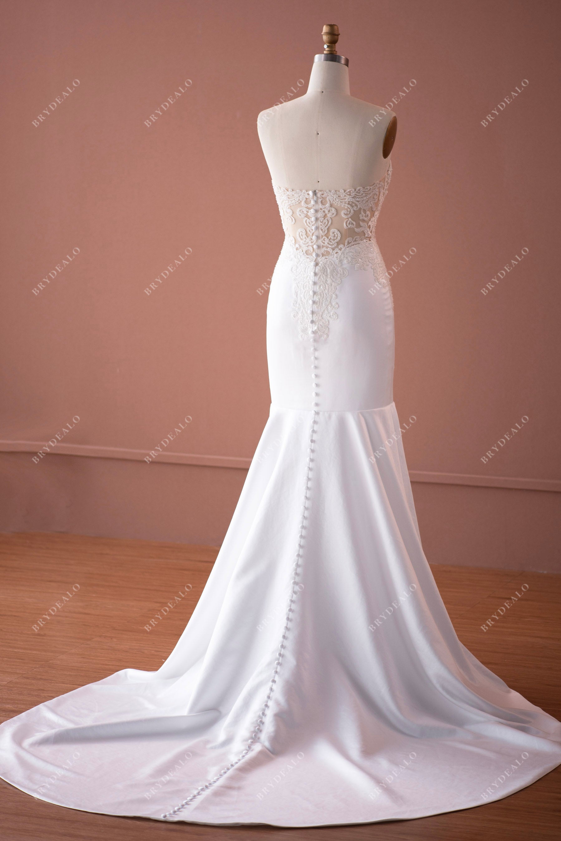 lace appliqued illusion back long train wedding dress with buttons adorned