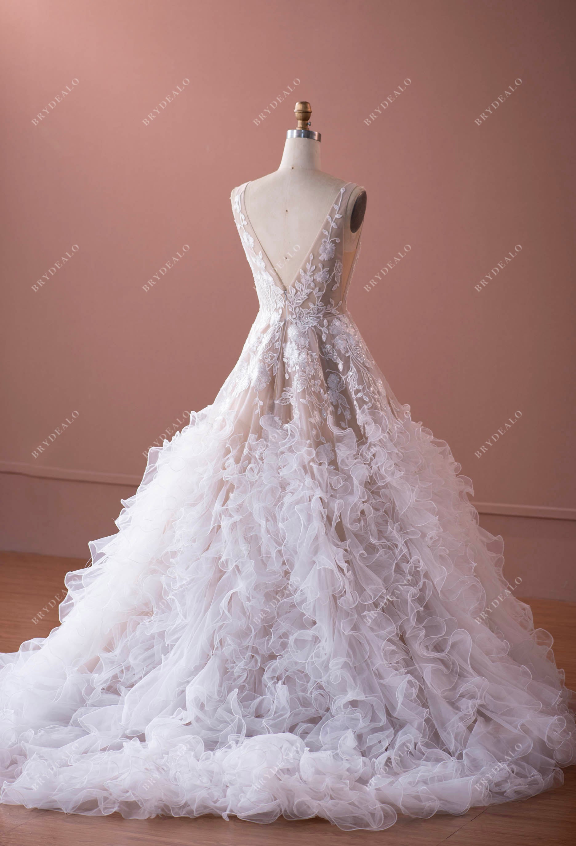 open back lace wedding dress with long ruffled skirt