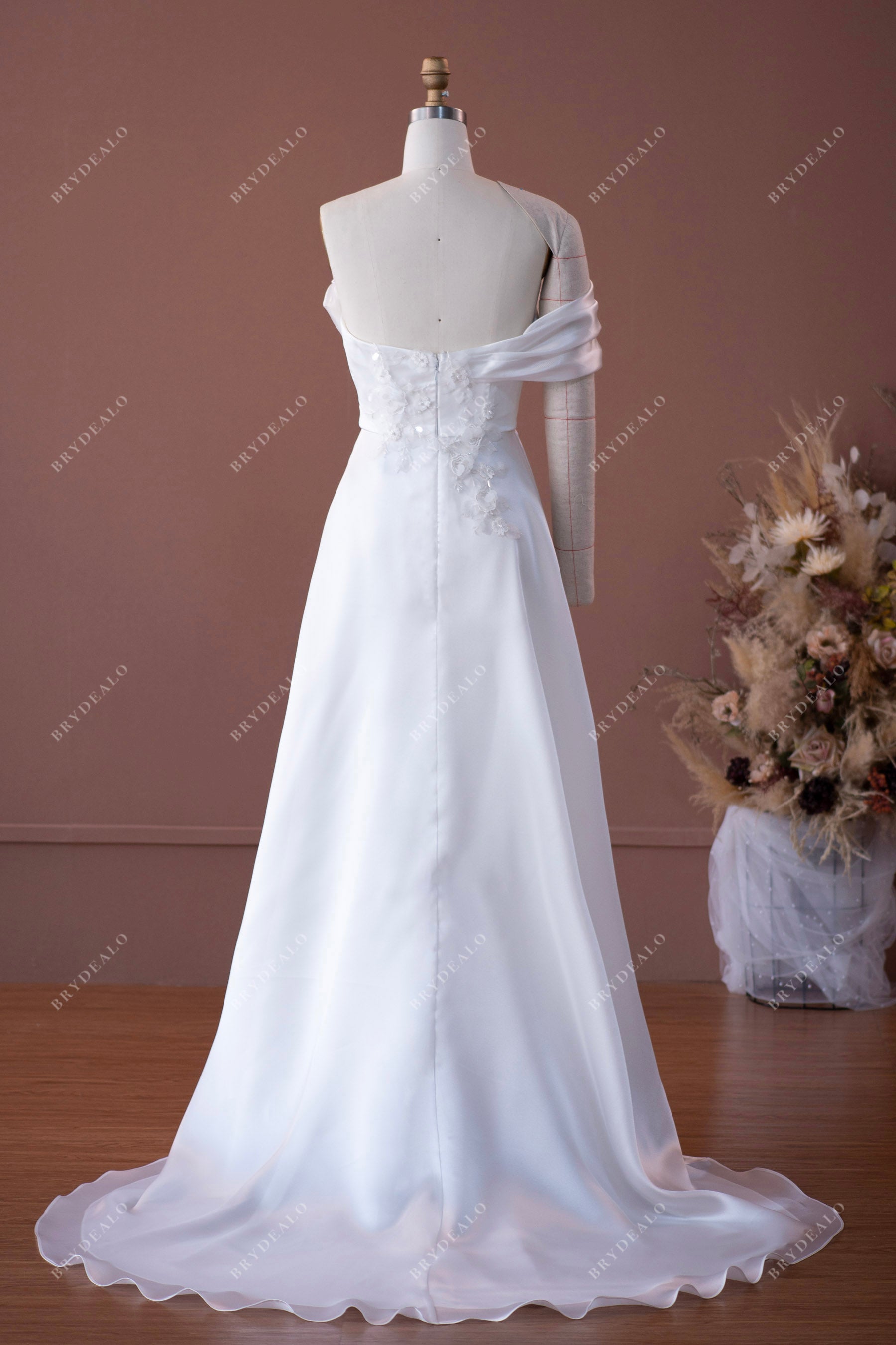 pleated neck one sleeve flowing organza wedding gown sample