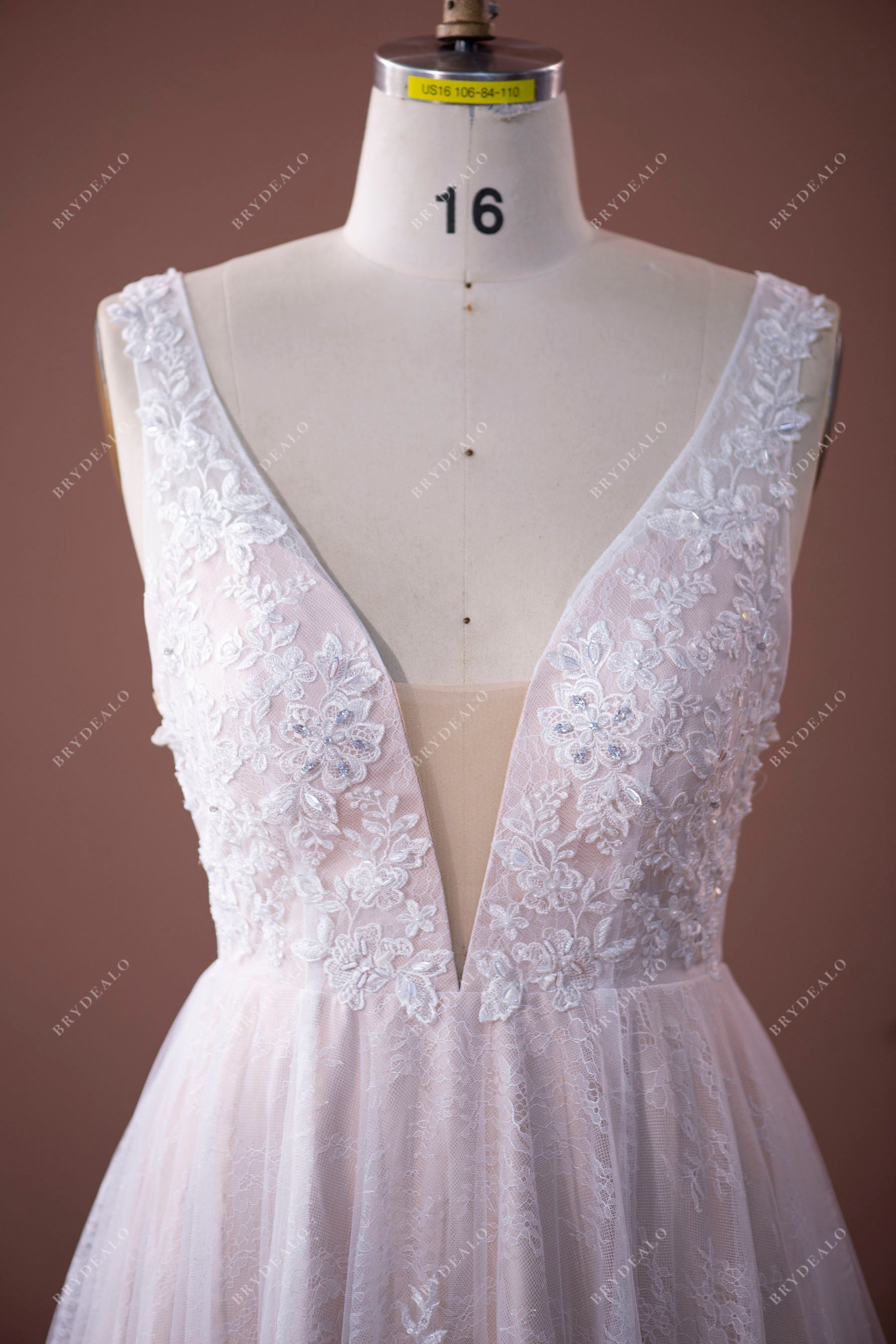 plunging neck beaded floral lace wedding gown
