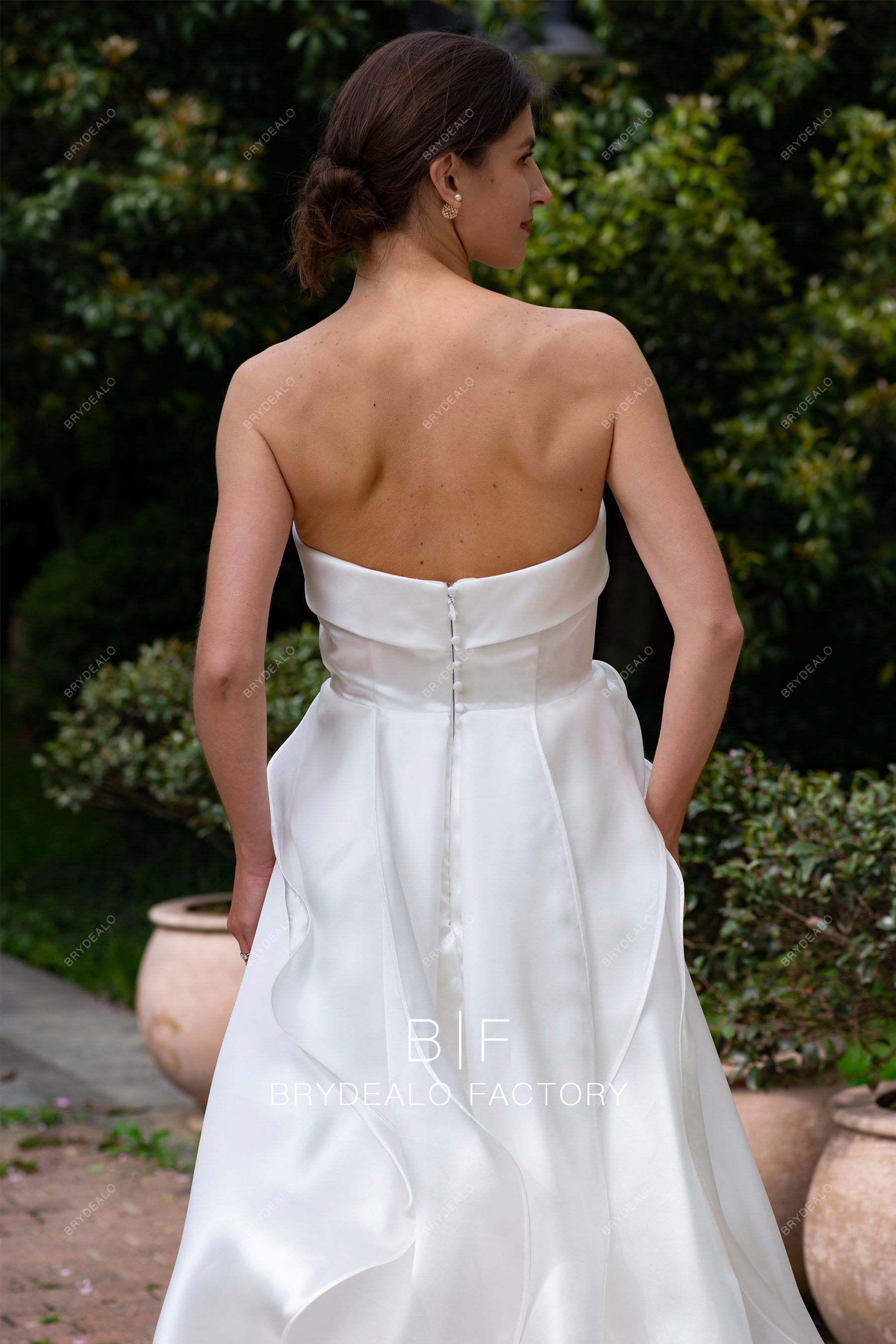 strapless buttoned back ruffled wedding dress