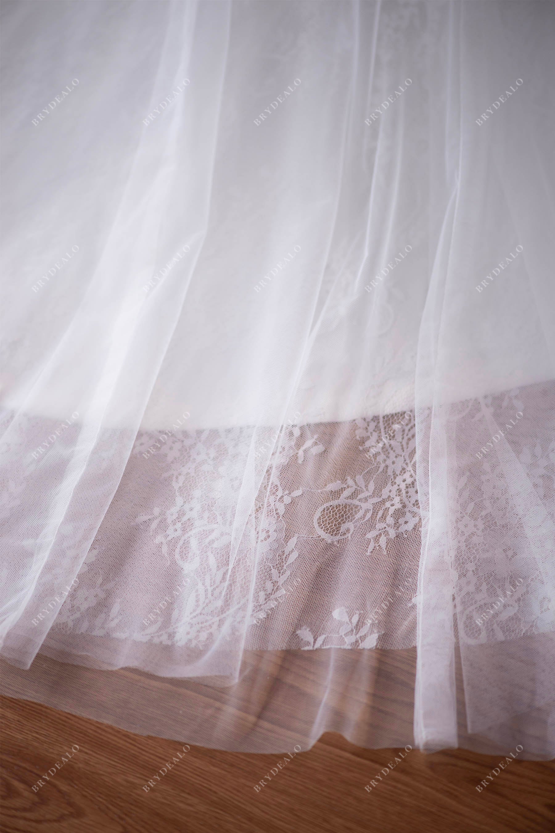 tulle overlaid lace wedding gown