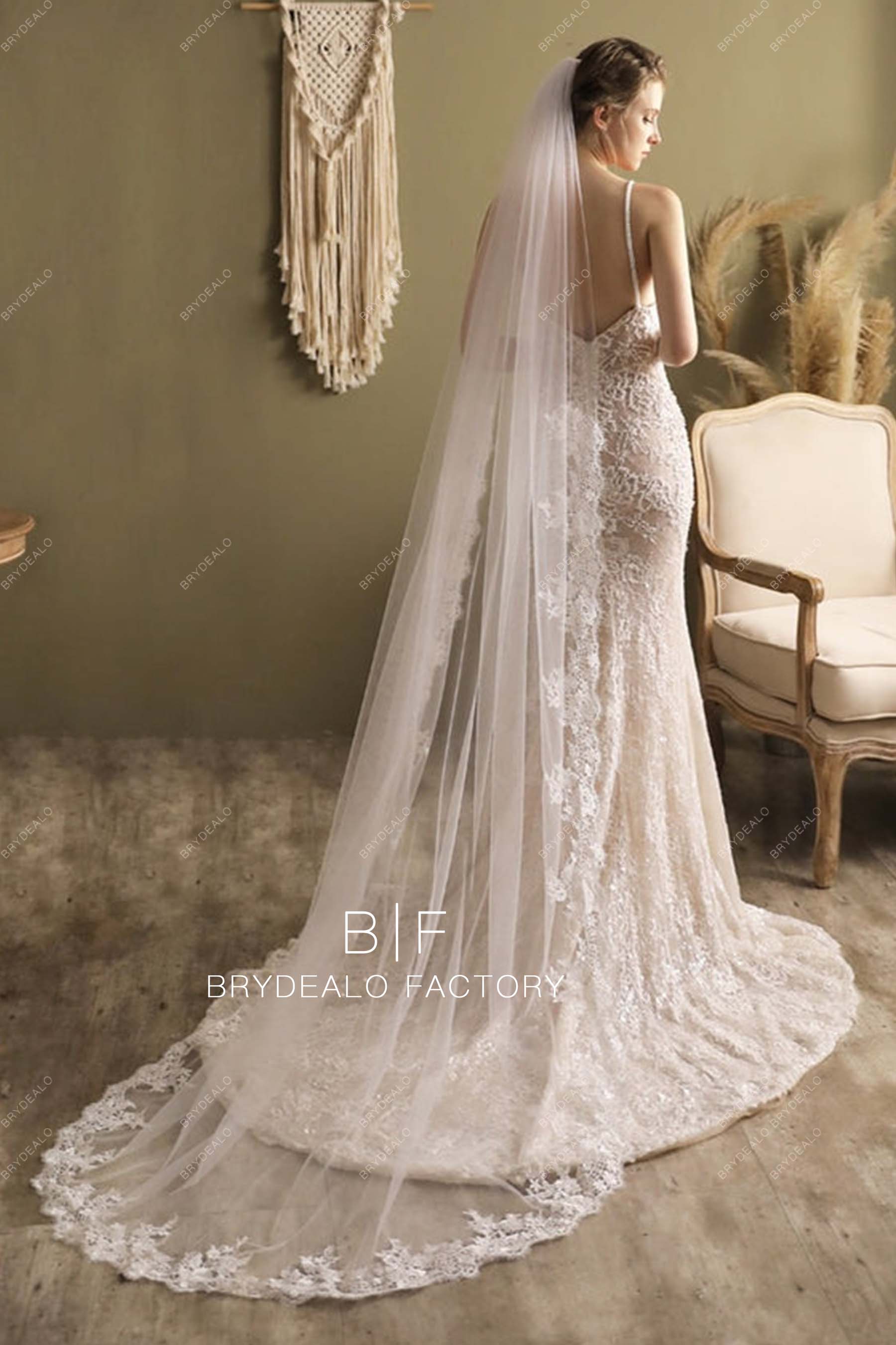 https://brydealofactory.com/cdn/shop/products/wholesale-chapel-length-veil-floral-lace-trim-bridal-veil.jpg?v=1670390925&width=1800